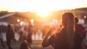 Image of people and a sunset in the background